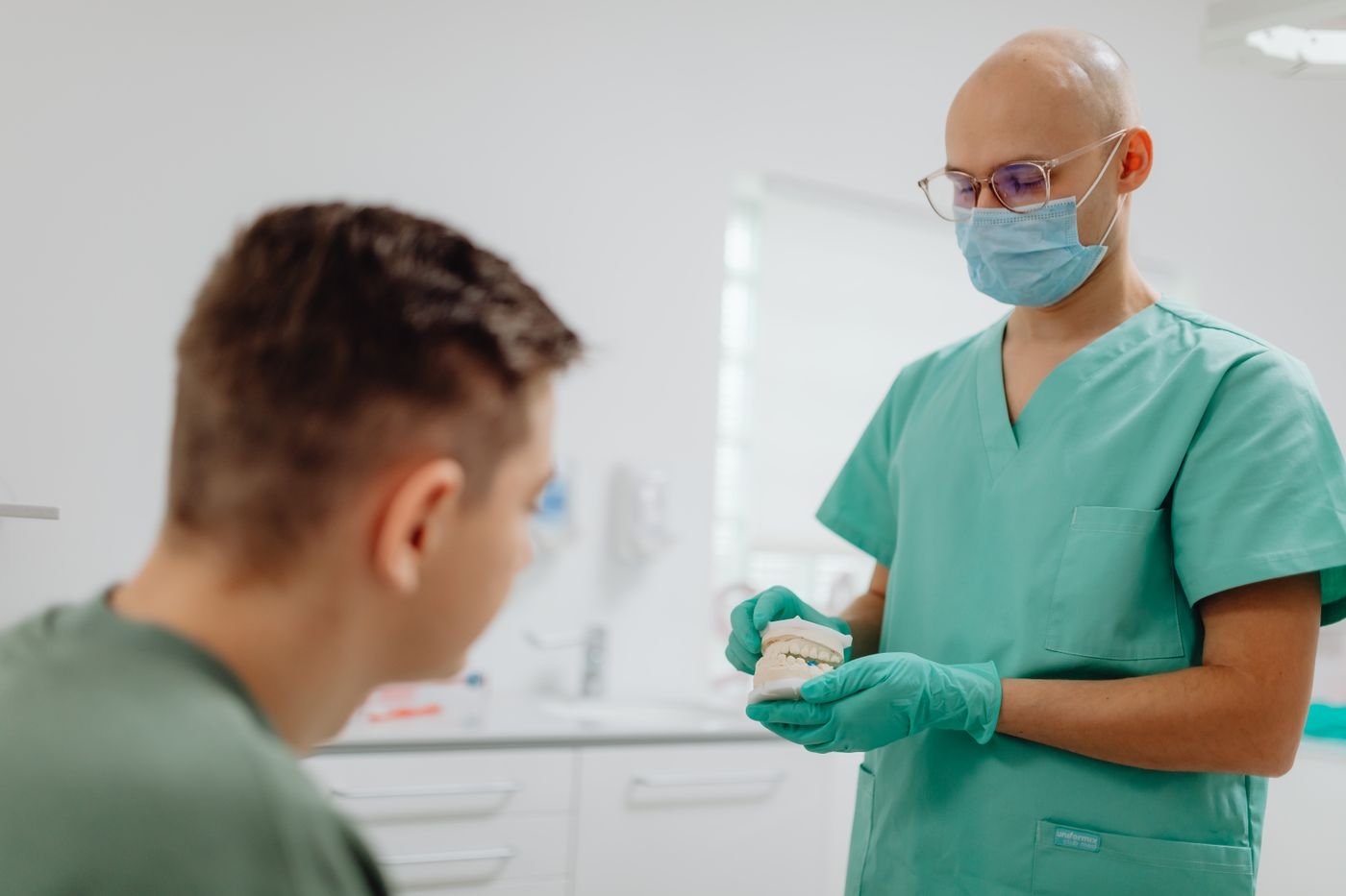 Dentist explaining a treatment plan to a patient