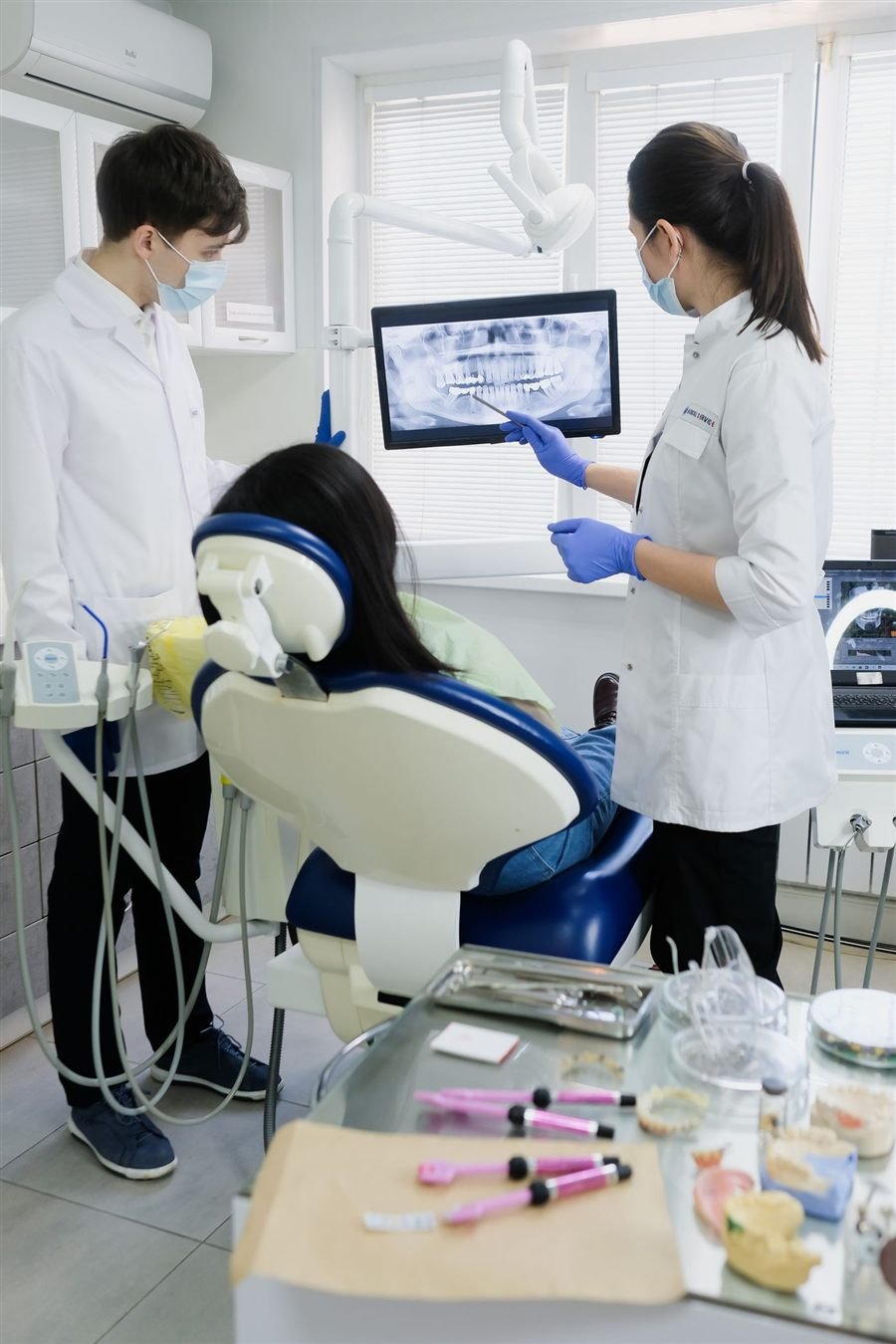 Dentists reviewing a digital dental X-ray
